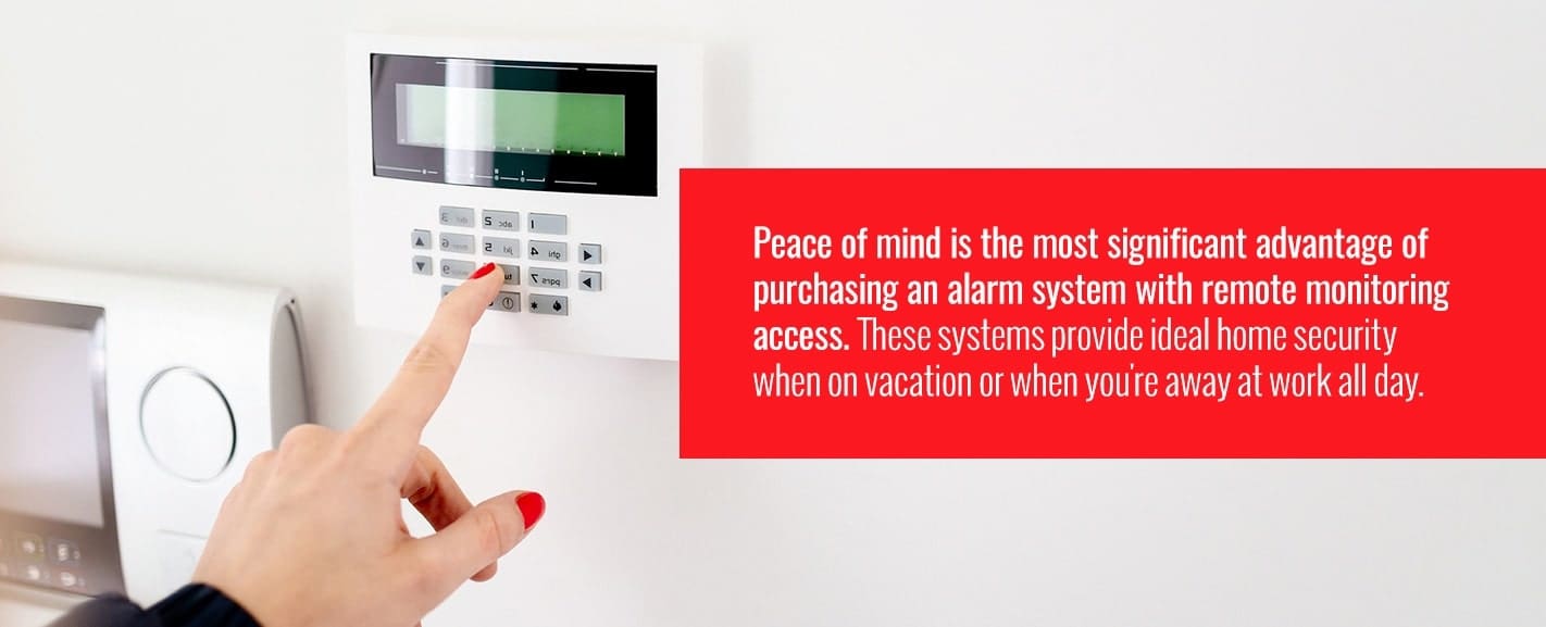 person pressing buttons on home alarm system