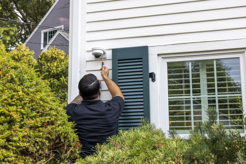 technician installing a residential camera